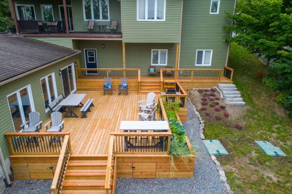 deck building Ontario — contractor building a wood deck in a residential backyard