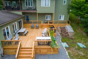 deck building Ontario — contractor building a wood deck in a residential backyard